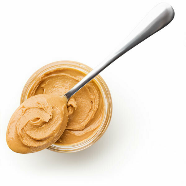 open peanut butter jar with spoon