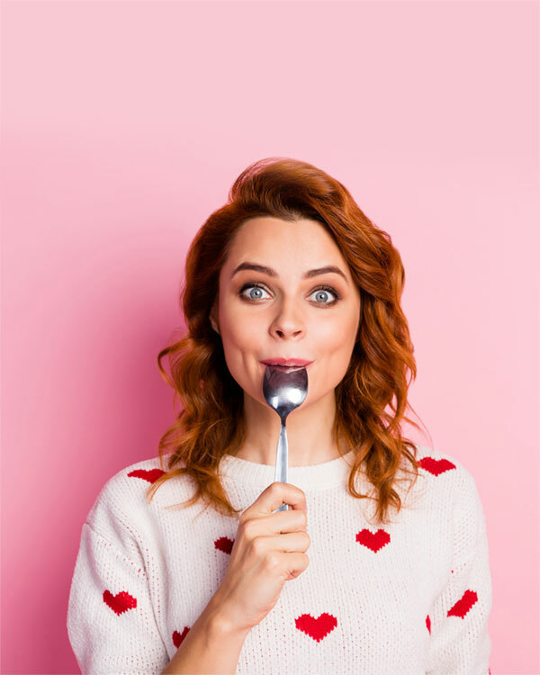 happy woman licking spoon